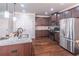 Granite countertops, stainless appliances, and a center island highlight this modern kitchen design at 965 Mulberry Bay Dr, Dacula, GA 30019