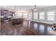 Open living space with hardwood floors, island seating and kitchen access at 965 Mulberry Bay Dr, Dacula, GA 30019