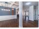 Open-concept living area with hardwood floors, coffered ceilings, and recessed lighting at 965 Mulberry Bay Dr, Dacula, GA 30019