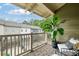 Relaxing outdoor balcony features a seating area with a view of the neighborhood and lush greenery at 1242 Morton Trce Se Trce, Atlanta, GA 30316