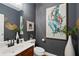 Stylish bathroom with a modern vanity, decorative artwork, and elegant decor at 1242 Morton Trce Se Trce, Atlanta, GA 30316