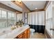 Bathroom showcasing a vanity with solid countertop, toilet, and shower with a white curtain at 1242 Morton Trce Se Trce, Atlanta, GA 30316