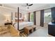 Comfortable bedroom with a four-poster bed, plenty of sunlight, and ample space at 1242 Morton Trce Se Trce, Atlanta, GA 30316
