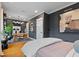 Bedroom with attached office features modern desk, custom shelving, and decorative artwork at 1242 Morton Trce Se Trce, Atlanta, GA 30316