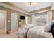 Bright bedroom featuring an ensuite bathroom, large window, and natural light at 1242 Morton Trce Se Trce, Atlanta, GA 30316