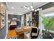 Bedroom featuring attached office with modern desk, custom shelving, and neutral decor at 1242 Morton Trce Se Trce, Atlanta, GA 30316