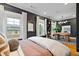 Spacious bedroom with a dedicated office space, neutral palette, and bright windows at 1242 Morton Trce Se Trce, Atlanta, GA 30316