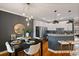Open-concept dining area and kitchen boasts modern decor, stainless appliances, and granite countertops at 1242 Morton Trce Se Trce, Atlanta, GA 30316