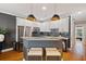 Contemporary kitchen with white cabinetry, granite countertops, stainless steel appliances, and barstool seating at 1242 Morton Trce Se Trce, Atlanta, GA 30316