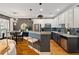 Modern kitchen featuring stainless steel appliances, granite countertops, and stylish bar seating at 1242 Morton Trce Se Trce, Atlanta, GA 30316
