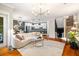 Spacious living room with an open floor plan, featuring hardwood floors and access to the kitchen and dining area at 1242 Morton Trce Se Trce, Atlanta, GA 30316