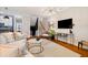 Cozy living room with hardwood floors, a modern TV setup, and comfortable seating arrangement at 1242 Morton Trce Se, Atlanta, GA 30316