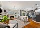 Stylish living area showcasing a fireplace, open layout, hardwood floors, and a modern chandelier at 1242 Morton Trce Se Trce, Atlanta, GA 30316