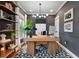 Stylish home office featuring a modern desk, geometric rug, and custom shelving at 1242 Morton Trce Se Trce, Atlanta, GA 30316