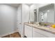 Modern bathroom with double sinks, granite countertops, and white cabinets at 1341 Midnight Ride Ct, Hampton, GA 30228