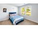 Comfortable bedroom with natural light, carpet flooring, and tranquil decor at 1341 Midnight Ride Ct, Hampton, GA 30228