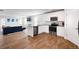 Open-concept kitchen with stainless steel appliances, granite countertops, and view to living area at 1341 Midnight Ride Ct, Hampton, GA 30228