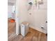 Well-organized laundry room with wire shelving, and vinyl floors at 1341 Midnight Ride Ct, Hampton, GA 30228