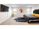 Spacious primary bedroom with large windows, plush carpet, and modern decor at 1341 Midnight Ride Ct, Hampton, GA 30228