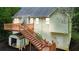 View of backyard showing elevated deck, stairs, storage shed, and home's exterior at 59 Abbotsford Dr, Villa Rica, GA 30180