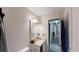 Bathroom features an extended vanity, sink, and an open door leading to the house at 59 Abbotsford Dr, Villa Rica, GA 30180