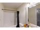 Standard bathroom featuring a shower-tub combination with modern fixtures and a framed mirror at 59 Abbotsford Dr, Villa Rica, GA 30180
