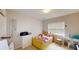 Well-lit bedroom with a window, dresser, and bright yellow twin-sized bed at 59 Abbotsford Dr, Villa Rica, GA 30180