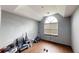Large bedroom with high ceilings, arched window, and hardwood floors at 59 Abbotsford Dr, Villa Rica, GA 30180