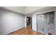 Spacious bedroom featuring a closet, wood floors, and doorway to a bathroom at 59 Abbotsford Dr, Villa Rica, GA 30180
