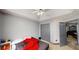 Cozy bedroom features a ceiling fan, closet, and doorway to another room at 59 Abbotsford Dr, Villa Rica, GA 30180
