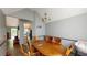 Cozy dining room with wood table, chandelier, and neutral paint at 59 Abbotsford Dr, Villa Rica, GA 30180