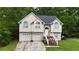 Charming two-story home with a white exterior, an inviting entryway, and a well-maintained yard at 59 Abbotsford Dr, Villa Rica, GA 30180