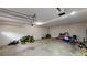 Spacious garage area providing substantial storage, and lawn equipment at 59 Abbotsford Dr, Villa Rica, GA 30180