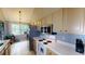 Functional kitchen with white appliances, ample counter space and plenty of natural light at 59 Abbotsford Dr, Villa Rica, GA 30180