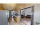 Open kitchen and living area with tiled floors and modern stainless steel appliances at 59 Abbotsford Dr, Villa Rica, GA 30180