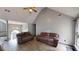 Inviting living room with vaulted ceiling, neutral paint, and laminate flooring at 59 Abbotsford Dr, Villa Rica, GA 30180