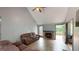 Spacious living room with vaulted ceiling, fireplace, laminate flooring, and neutral paint at 59 Abbotsford Dr, Villa Rica, GA 30180
