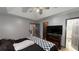 Large main bedroom featuring a tray ceiling, ceiling fan, and ensuite bathroom at 59 Abbotsford Dr, Villa Rica, GA 30180