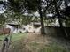 View of back exterior featuring wood decks, back door, and yard with partial fencing at 1038 Westfield Se Trce, Smyrna, GA 30082