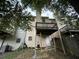 Back exterior showing wood decks, door, and yard of this multi-story home at 1038 Westfield Se Trce, Smyrna, GA 30082