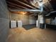 Unfinished basement featuring exposed ductwork and concrete flooring, laundry machines at 1038 Westfield Se Trce, Smyrna, GA 30082