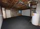 Spacious unfinished basement with painted walls, concrete floors, water heater, and exposed ducts at 1038 Westfield Se Trce, Smyrna, GA 30082