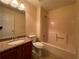 Bathroom featuring a vanity with granite countertop, toilet, and shower-tub combination at 1038 Westfield Se Trce, Smyrna, GA 30082