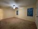 Large bedroom with two windows, neutral carpet, and ceiling fan at 1038 Westfield Se Trce, Smyrna, GA 30082