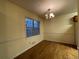 Bright dining room with a chandelier, chair rail detail, and hardwood flooring at 1038 Westfield Se Trce, Smyrna, GA 30082