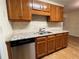 Renovated kitchen showcasing granite countertops, stainless steel appliances and wood cabinets at 1038 Westfield Se Trce, Smyrna, GA 30082