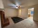Bright living room features a brick fireplace, neutral carpeting and a ceiling fan at 1038 Westfield Se Trce, Smyrna, GA 30082