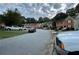 Street view of the neighborhood featuring townhomes and parked cars at 1038 Westfield Se Trce, Smyrna, GA 30082
