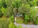 A charming home nestled among lush green trees offers a private and serene setting at 1490 Diplomat Dr, Riverdale, GA 30296