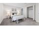 Bright bedroom featuring a bed, neutral decor, and closet at 1490 Diplomat Dr, Riverdale, GA 30296